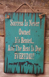 Success Is Never Owned Antique Sign